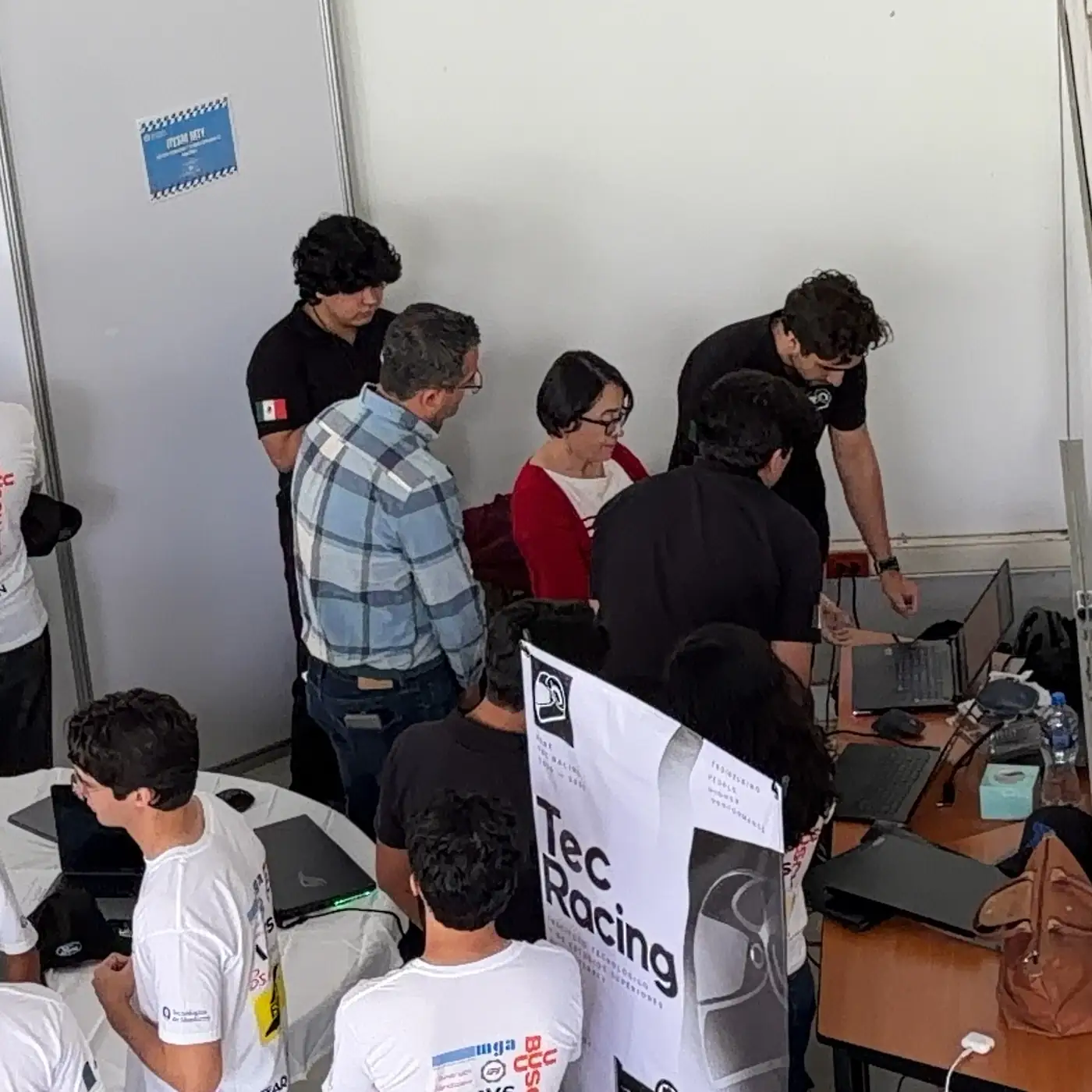 The team working under the TEC Racing banner at its stand during the competition