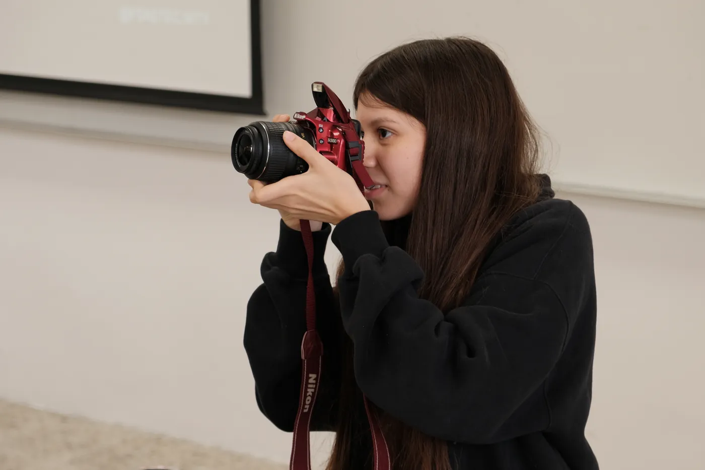 A team member photographing for the team social channels