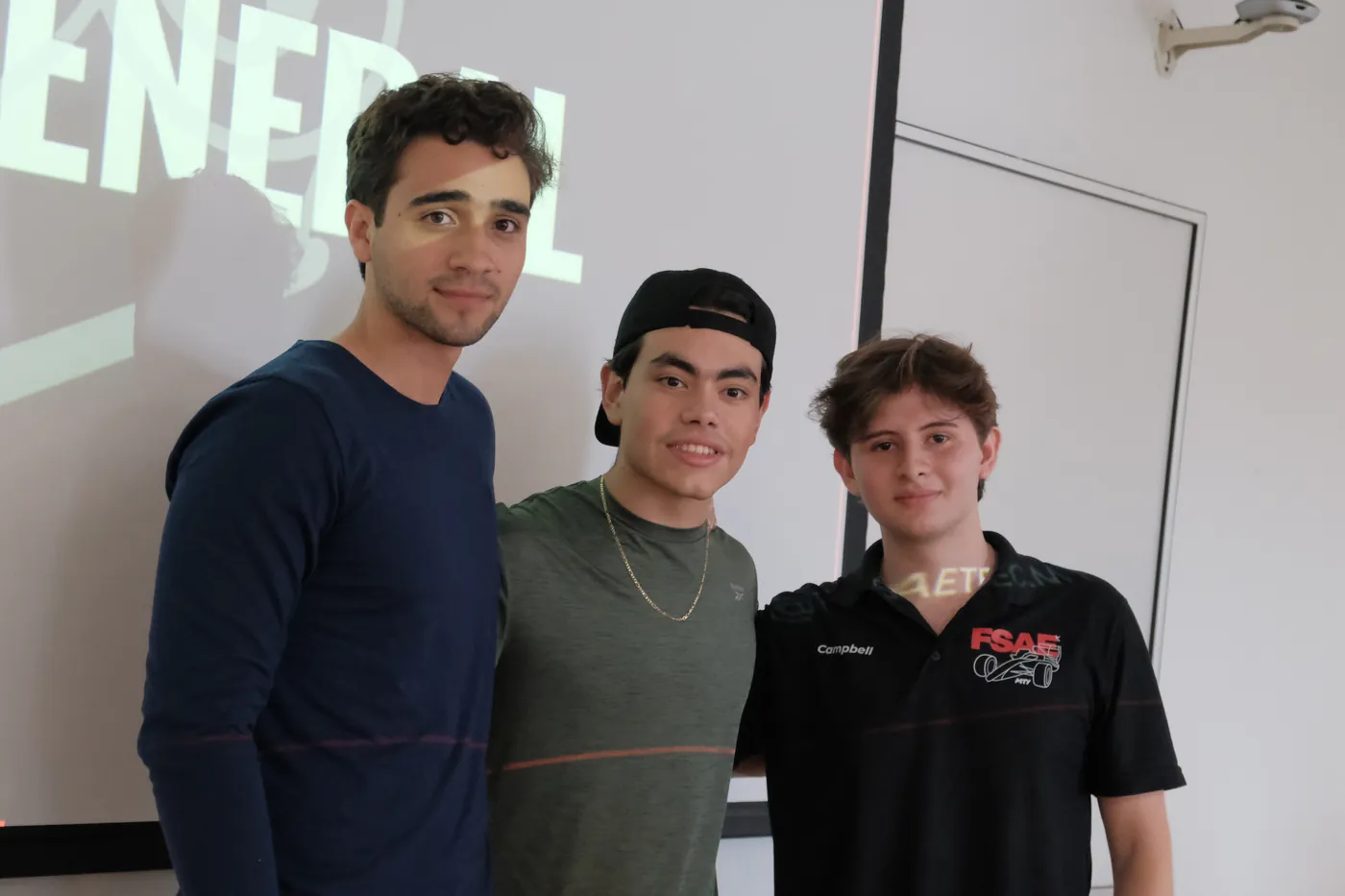 Team members in Tec Racing apparel at a team event